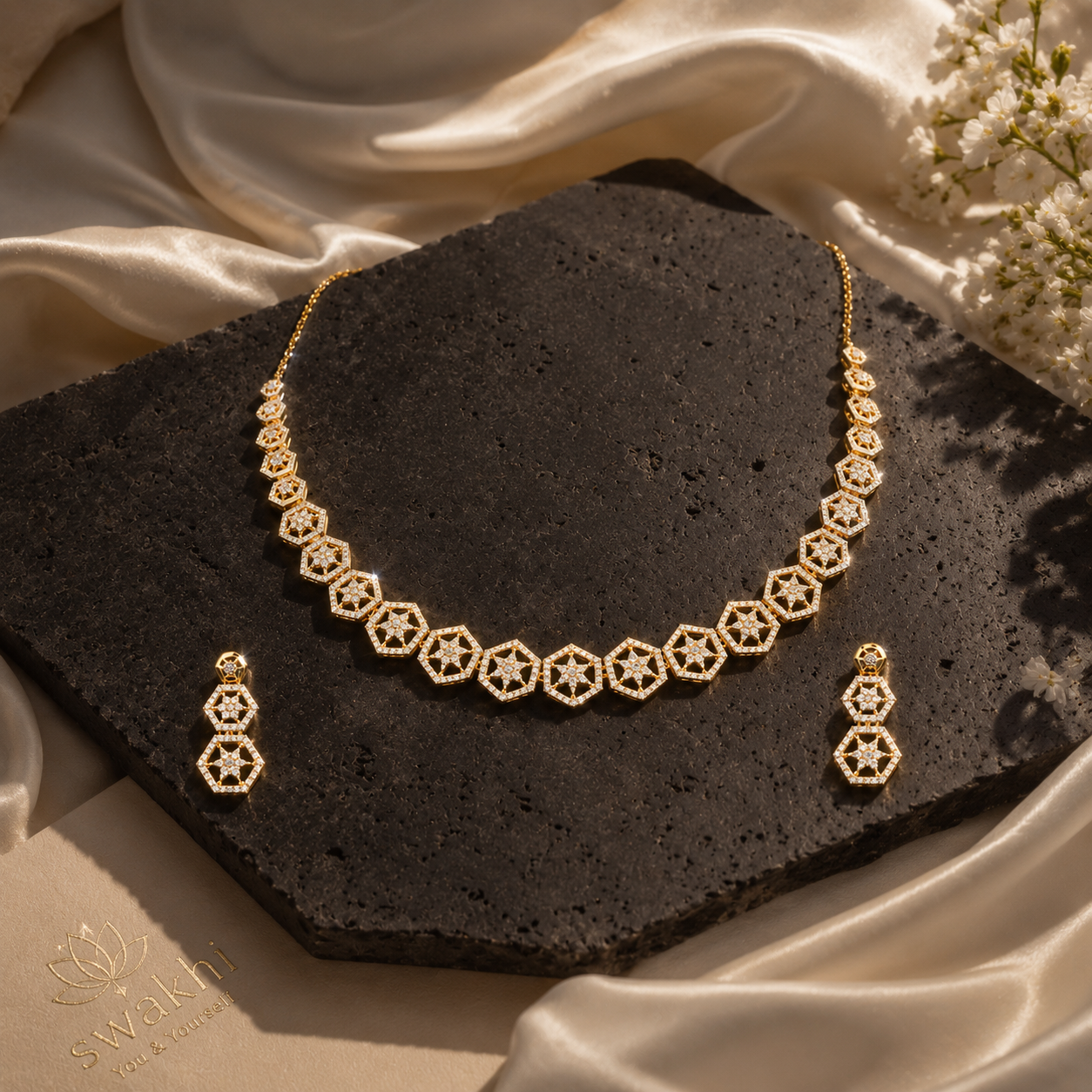 Celestial Hexagon Necklace Set, 24K Gold Plated, Demi-Fine Jewellery on a black stone