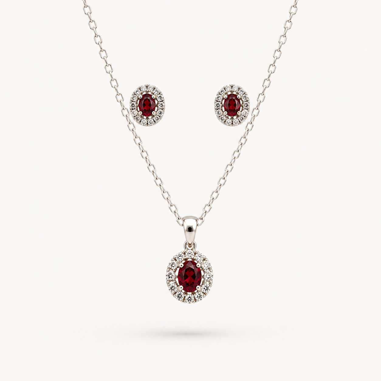pendant and earrings featuring red gemstones_White BG