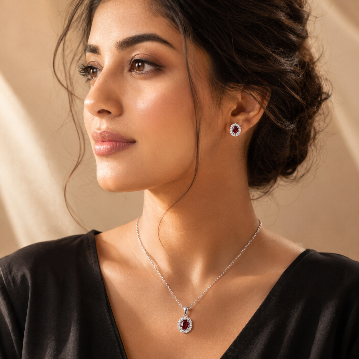 Woman wearing a necklace and earrings in black dress