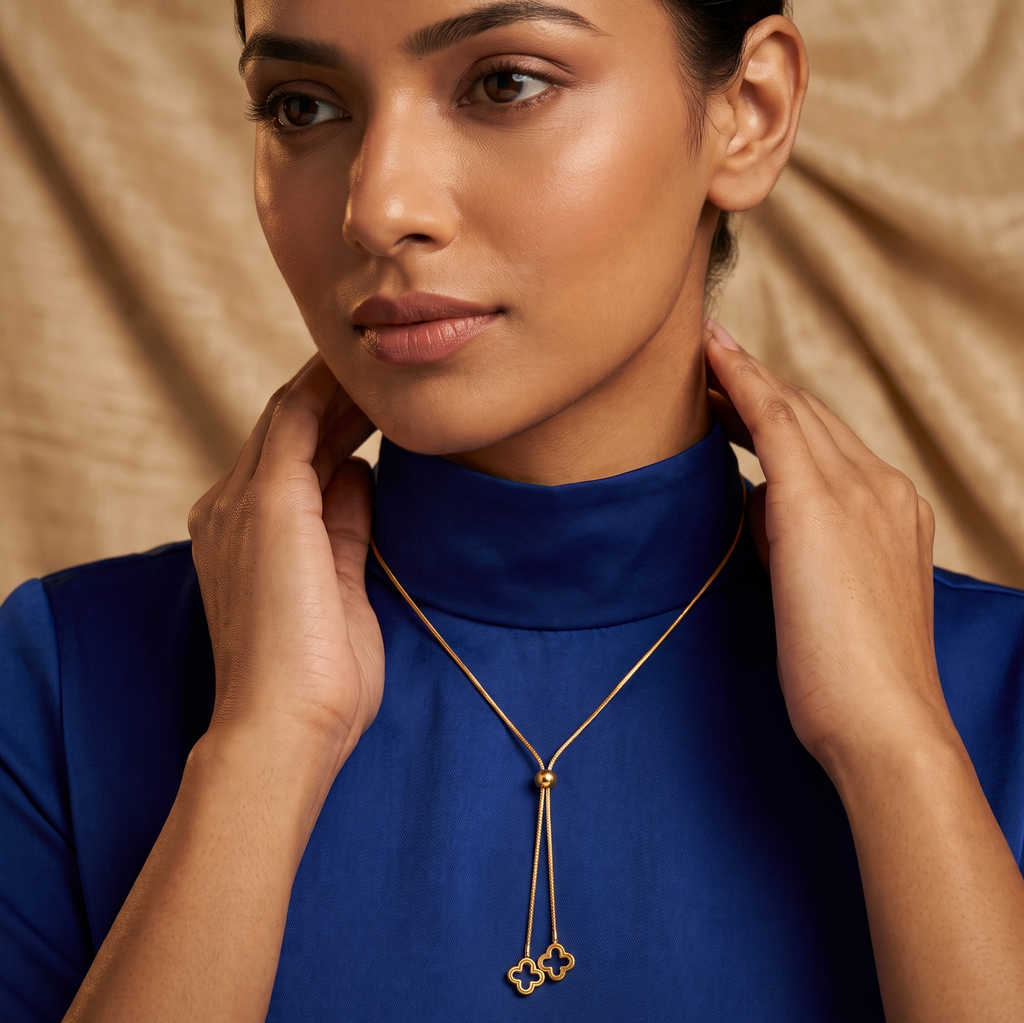 Woman wearing Double Clover Drop Pendant against a beige background