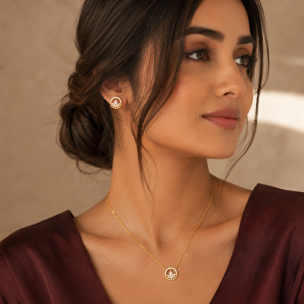 Woman wearing Floral Halo Pendant & Stud in maroon dress against a neutral background