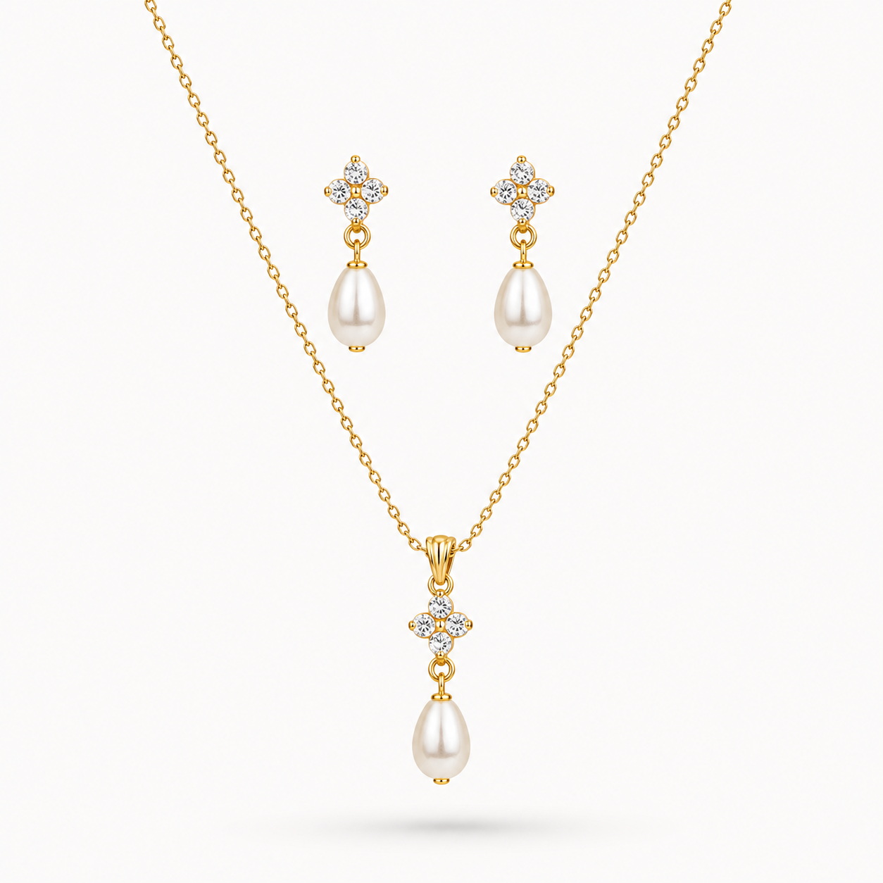 Pearl Drop Pendant & Earrings earrings set with pearls and diamonds on a white background