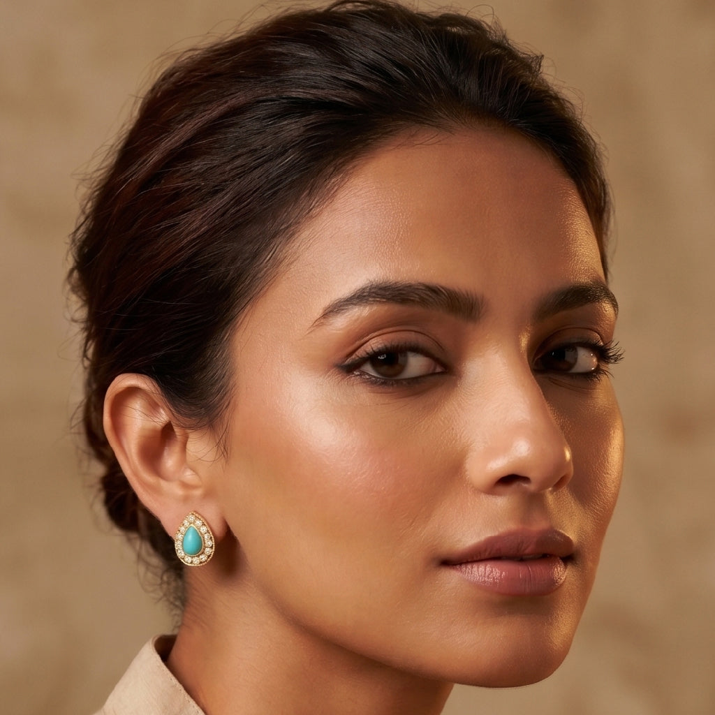 A woman wearing Turquoise-Blue Teardrop Studs